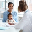 Mother and baby in tongue tie specialty dental office