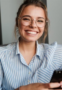 a woman near Pepper Pike smiling after orofacial myology treatment