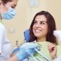 Smiling woman discussing tongue tie with lip tie and tongue tie specialist