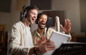 two men freely being able to sing after tongue-tie therapy