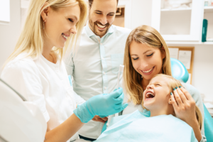 a child visiting their dentist for a frenectomy