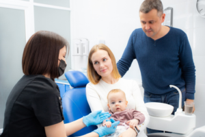 a closeup of an infant visiting their dentist